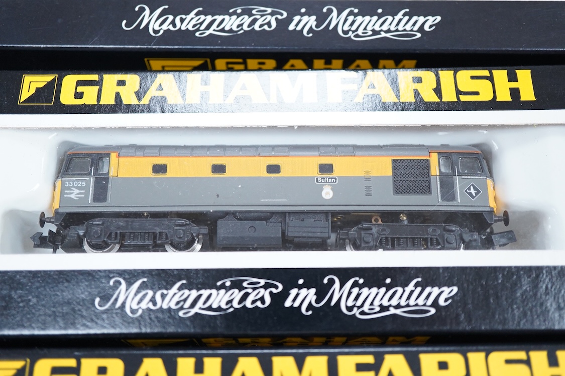 Four boxed Graham Farish N gauge railway Class 33 diesel locomotives; a BR, D6572 (8314), a BR Distribution Sector, 33 205 (8317), an EWS, 33030 (831A) and a BR, 33025 (8312).